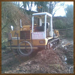 Tracked machine in deep mud, no conditions too wet!